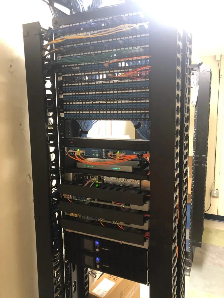 Network rack with patch panels and switches